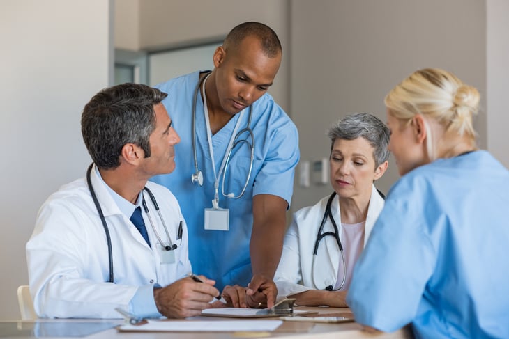 Doctors-in-a-meeting-667828930_1256x838