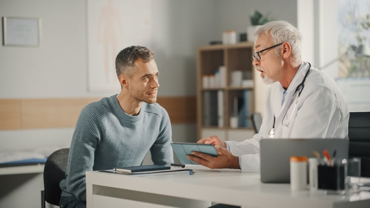 male-asian-elderly-doctor-consultation-room-doctor-showing-analysis-results-on-tablet-print